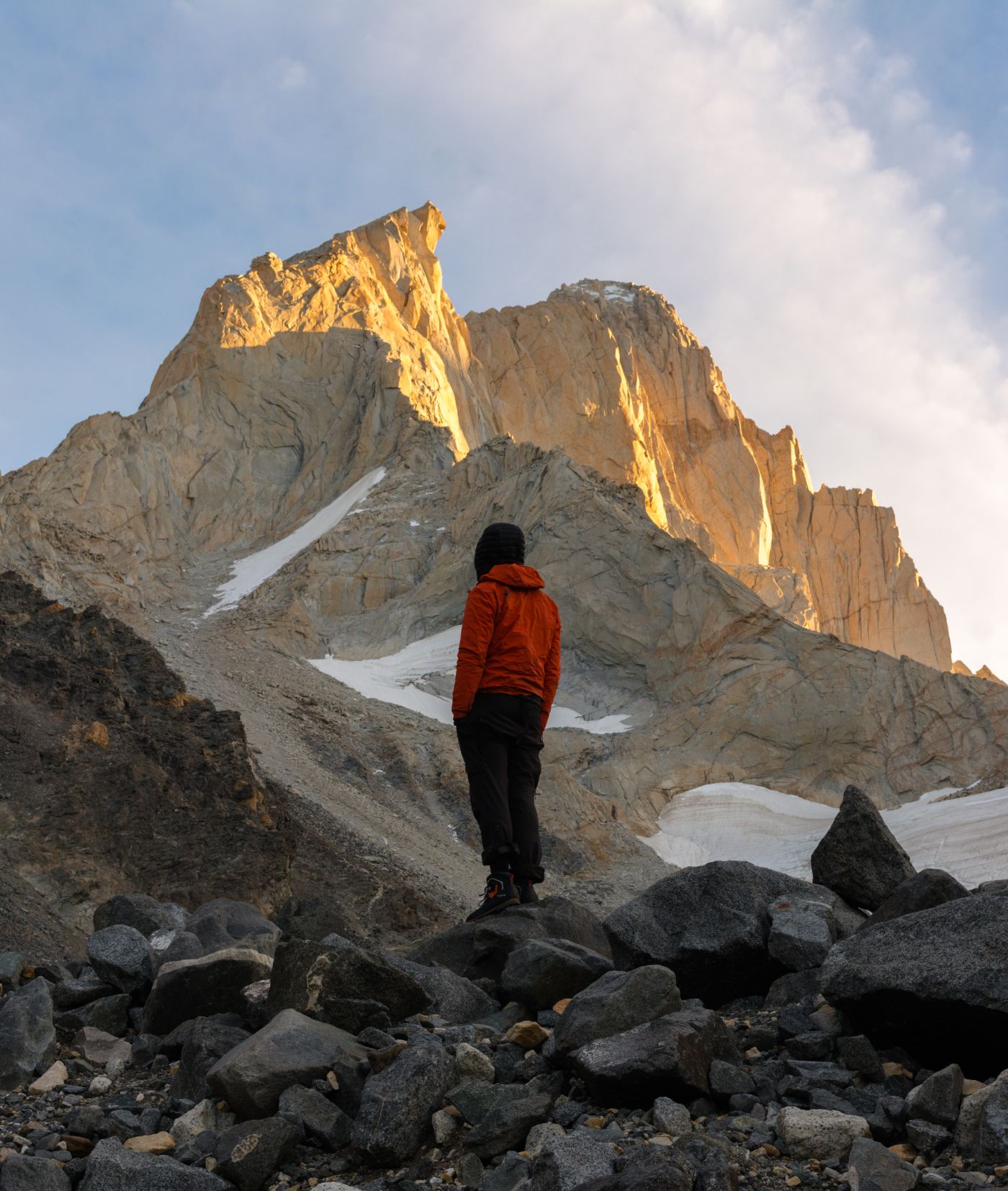 Climber looking at the wall at sunrise in El Chaltén